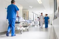 Hospital corridor with nurses and patients