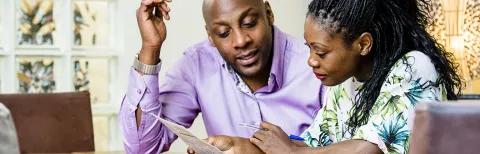 Man and woman looking at papers
