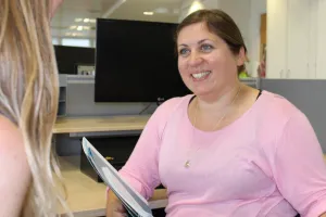 Staff member having a discussion about a case