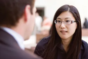 Young woman talking to a man for advice