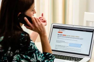 Woman looking at PHSO online complaint form