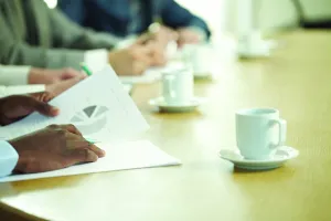 Photo of close up of hands with paperwork