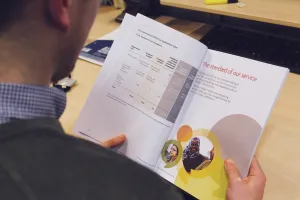Member of staff looking at annual report