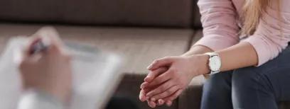 Close up of woman's hands during counselling