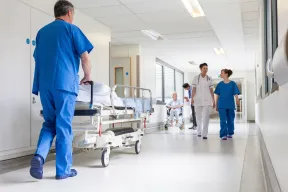 Hospital corridor with nurses and patients