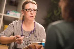 Photo of GP talking to patient