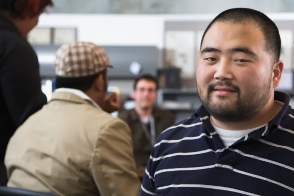 Photo of an asian man looking in to the camera
